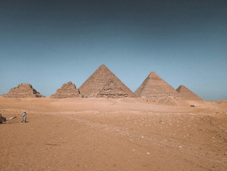 Stunning view of the Great Pyramids of Giza in Egypt under a clear sky.
